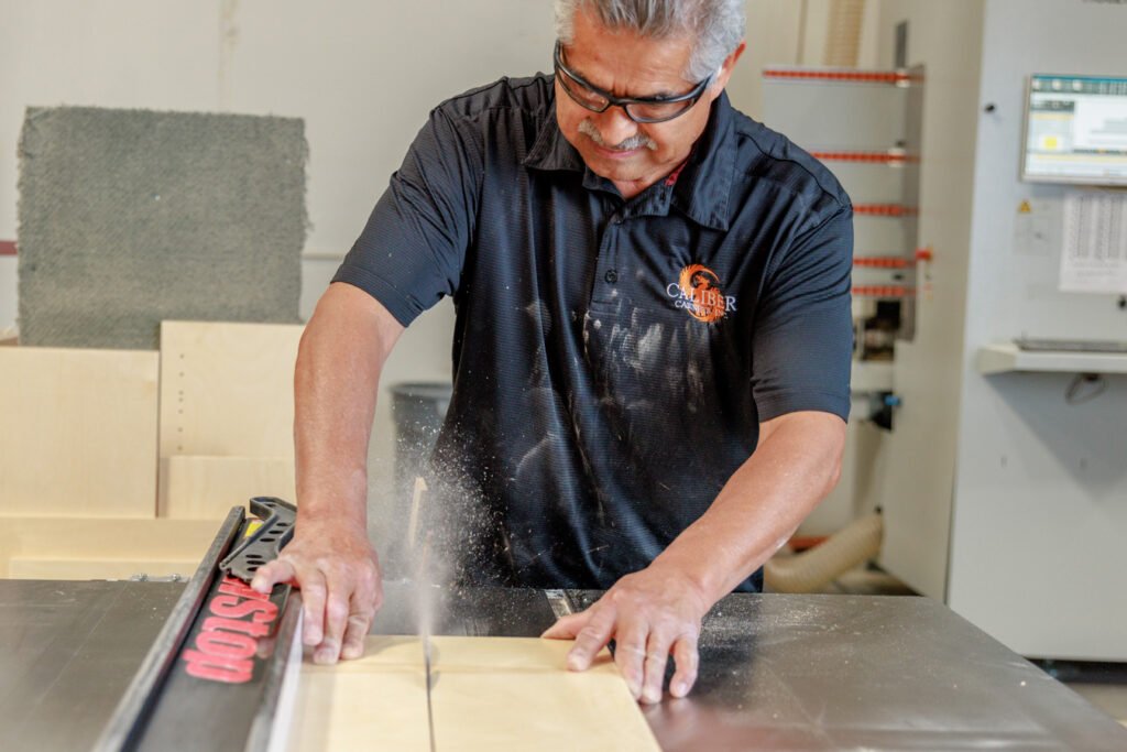 Man using a table saw.