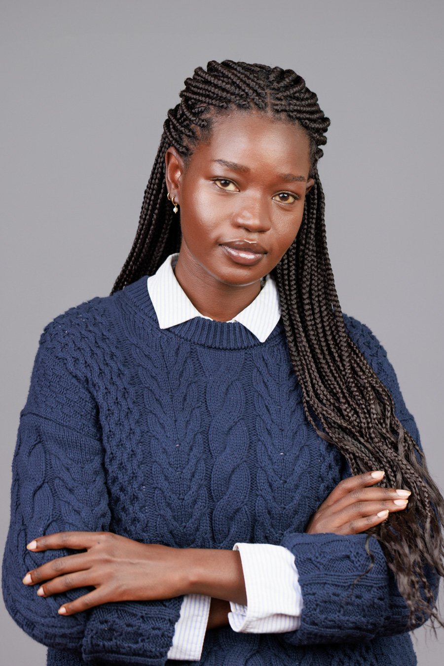 Women's corporate headshot with a clean, open collar neckline — polished and professional portrait photography